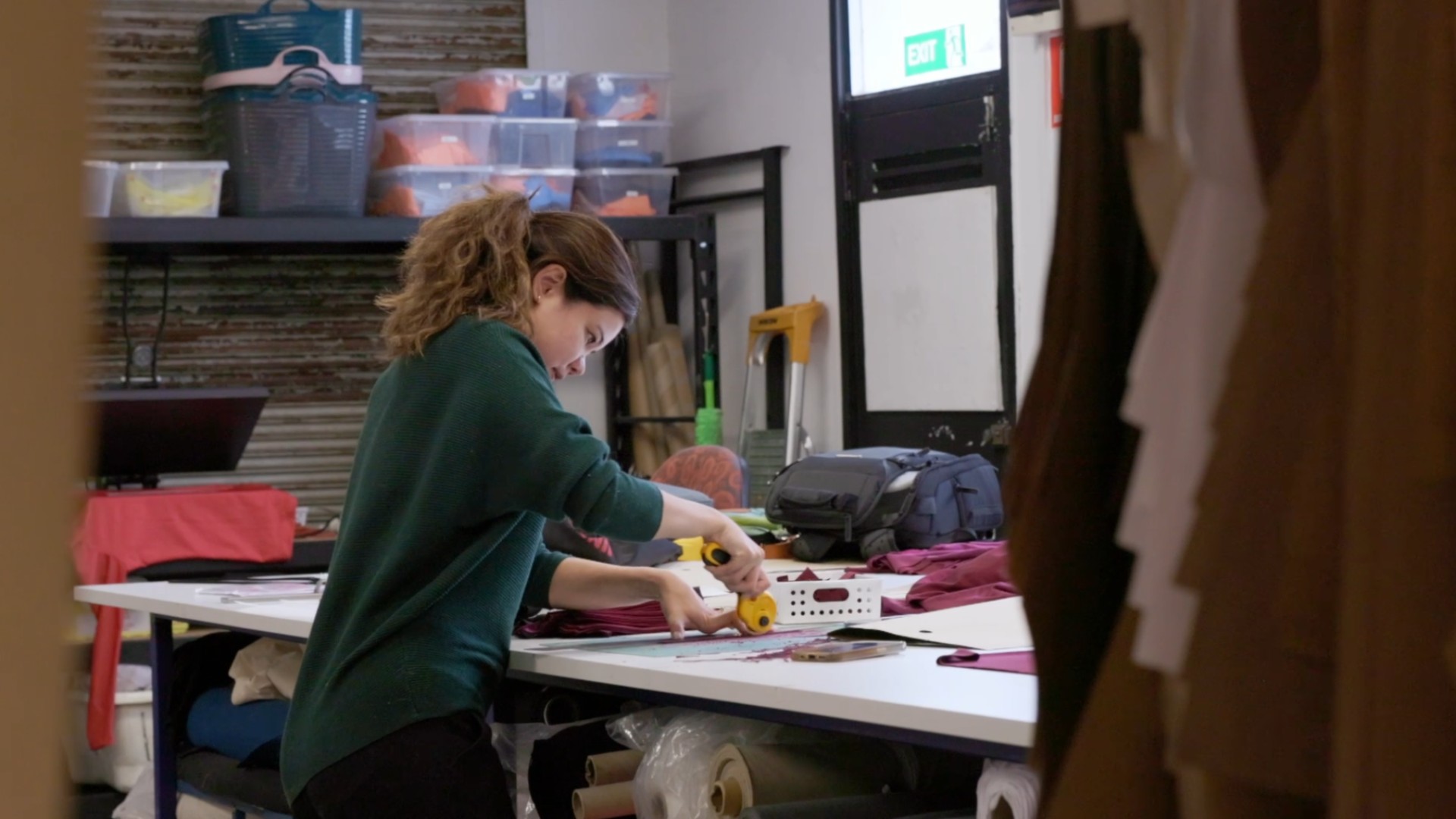 Women cutting fabric at ethical edge collective